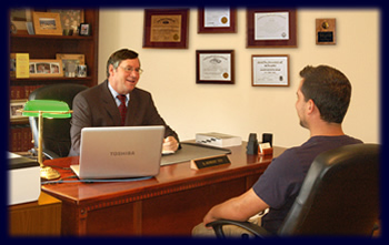 Image of Attorney Bob Toy talking to a male client