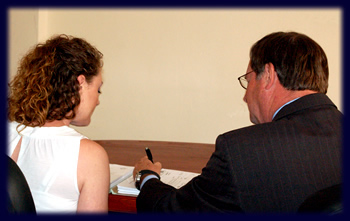 Image of attorney Bob Toy with a female client